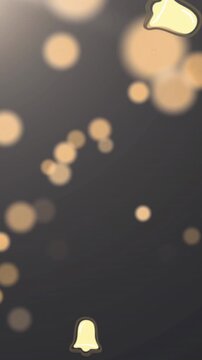 Animation of multiple christmas bell icons and spots of light against grey background