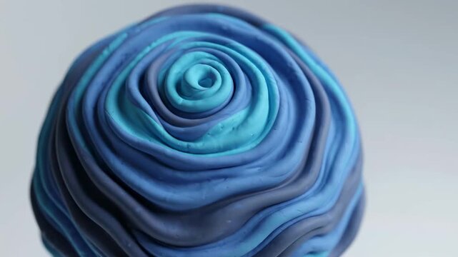 Elegant blue and dark swirl cake topper decoration perfect for weddings, events, and luxury dessert displays with vibrant gradient texture.
