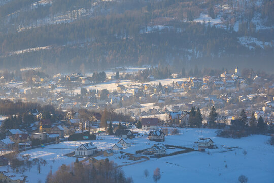 Panoramic view of a snow-covered mountain village in winter in the Beskid Mountains, Istebna, Poland