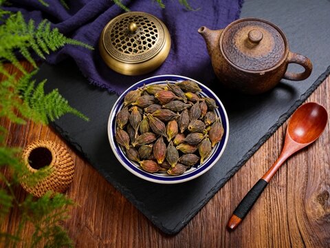 Dried Gardenia Flowers in Black Bowl with Teapot and Incense Burner