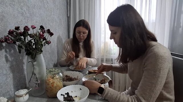 Sharing meals at home with friends during a gathering