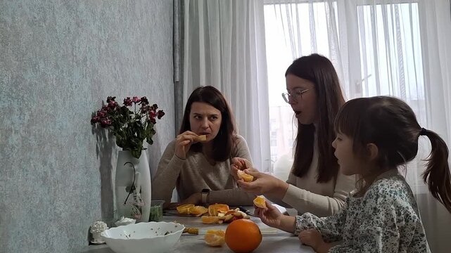 Eating oranges at home with family on a quiet afternoon
