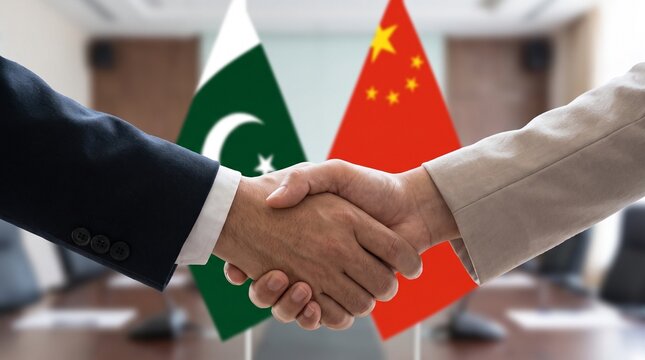 Business handshake between Pakistan and China representatives in a professional office setting.
