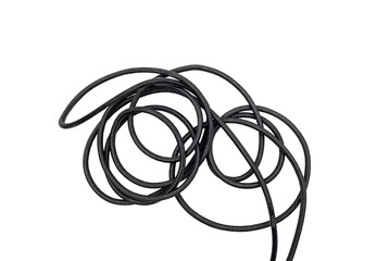 Tangled black cord coiled against a transparent background, showing loops, texture, and overlapping strands in a simple isolated composition. © Mukta