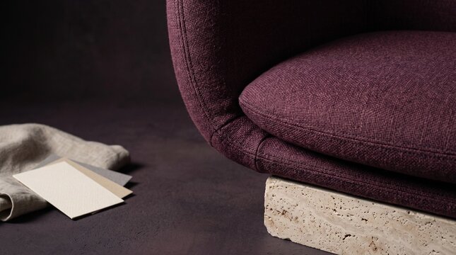 Plum upholstery and stone detail of sculptural seating