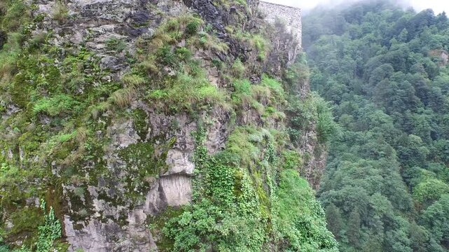 Zilkale castle rises above a steep forested valley in Rize, showing medieval stone architecture. Ancient fortress and green mountain slopes create a dramatic heritage landmark in the Black Sea region.