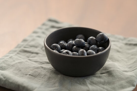 blueberries in a black ceramic bowl