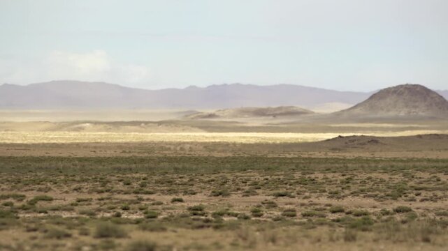 Australian outback desert plains stretch across treeless arid terrain beneath extreme dry weather. Endless wasteland flatlands express drought desertification and remote continental barrens.