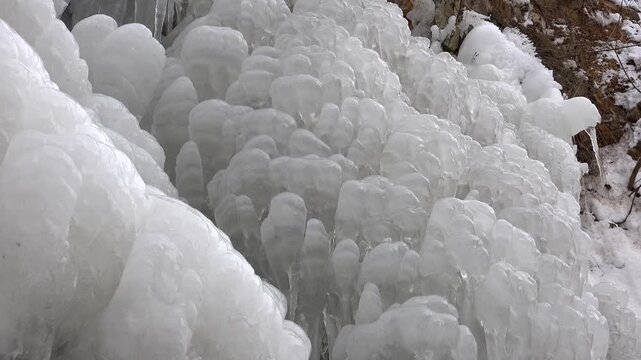 Frozen ice block forming natural crystalline shapes within extreme cold winter environment. Solid crystal display severe freezing, raw texture, abstraction, visual appeal, clean composition.