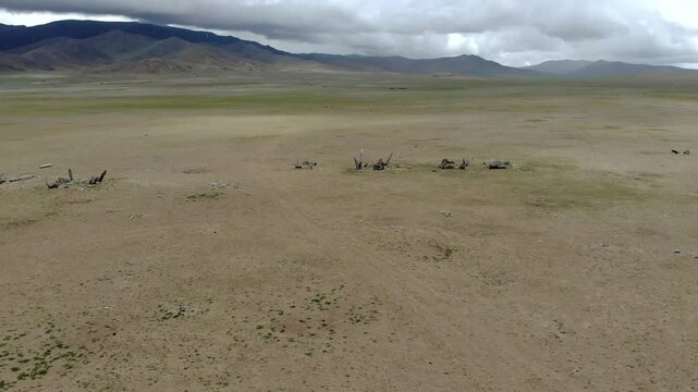 Ancient ritual burial site with deer stones and balbal monuments across Central Asian steppe. Prehistoric stele records nomadic belief, funerary custom, archaeological value, early Eurasian heritage.