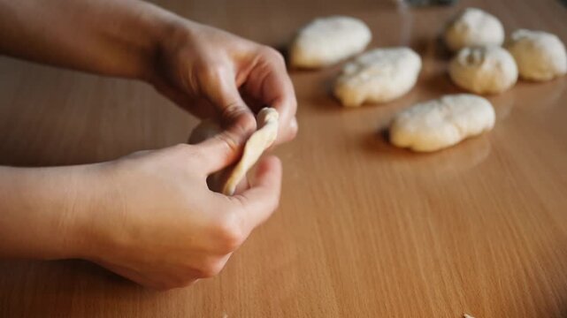 Making yeast dough pies with potato filling close up