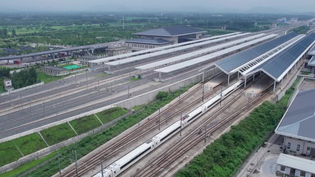 Modern Railway Station with Covered Platforms and Multiple Tracks