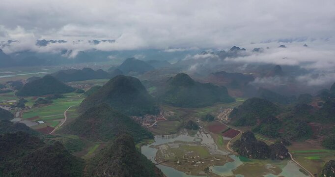 Misty Karst Mountains and Farmland Aerial Landscape