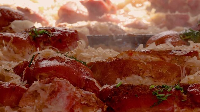 Steaming roasted pork knuckle with sauerkraut cooking at street market