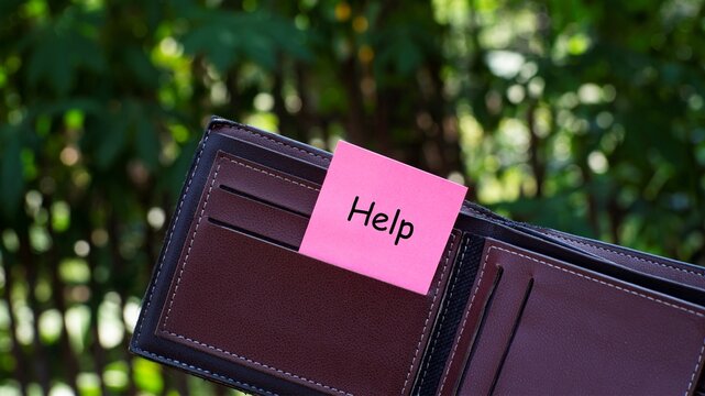 Open Wallet With Help Sticky Note Financial Assistance Concept, representing financial hardship, debt, emergency expenses, or the need for financial support.