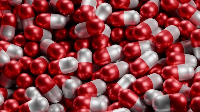 Red and white capsules dominate the frame. Glossy surfaces reflect light. Capsules are evenly clustered. Each pill has distinct halves. No people or animals present