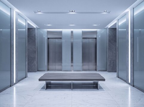 Modern elevator lobby with brushed metal doors and a marble floor