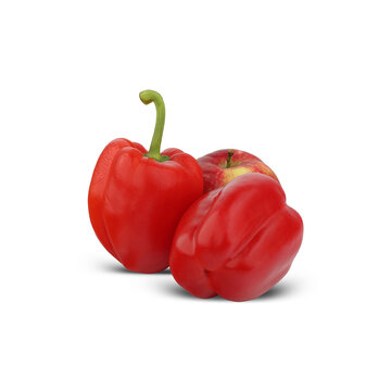 two red bell peppers next to an apple