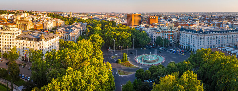 Neptune Fountain and Plaza de Canovas del Castillo at Sunset in Madrid