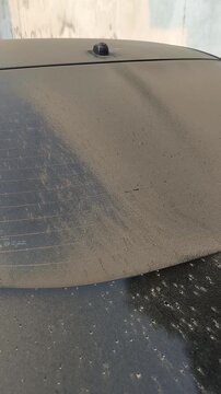 Volcanic Ash Covering Car Window After Mount Anak Krakatau Eruption