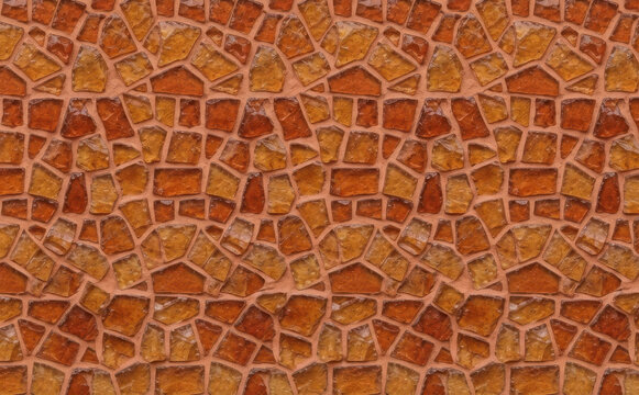 Seamless brown stone wall texture background with irregular mosaic tiles and grout pattern for architectural design and interior decoration projects