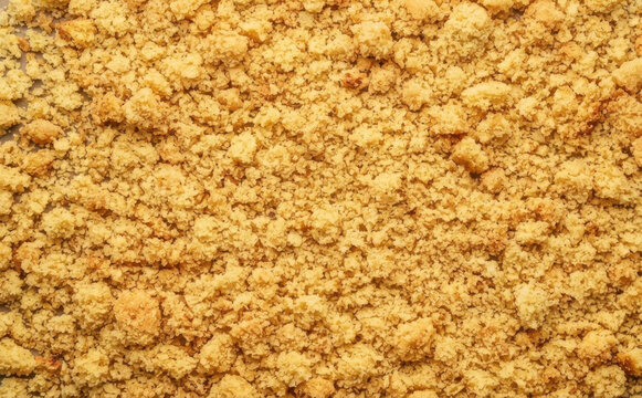 Crumbly sweet cookie crust texture background for baking recipes and dessert concepts