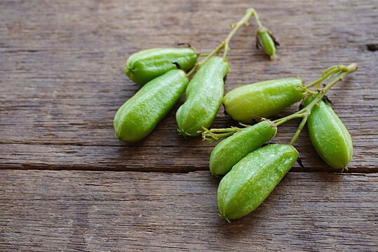 Tropical fruit. In Malay called belimbing Buluh, scientifically known as Averrhoa bilimbi. Strong sour and acidic taste. Ingredient for giving sour taste to food