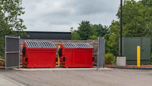 large red commercial dumpster for trash and recycling