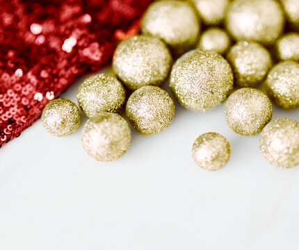 Glitter gold baubles and red sequin textile