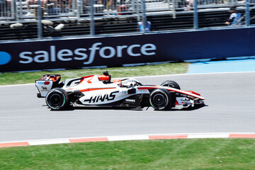 Fototapeta premium May 24, 2026, Montreal, Canada, Esteban Ocon races a Haas F1 car at Circuit Gilles-Villeneuve. g.