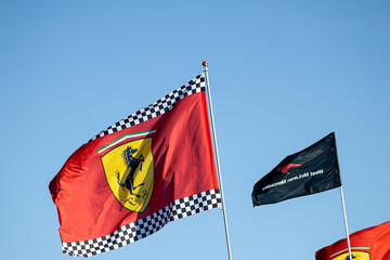 Obraz premium 24 May 2026, Montreal, Canada: Ferrari flags wave above Formula 1 fans at Grand Prix weekend. g.