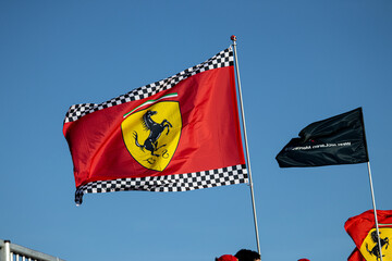 Obraz premium 24 May 2026, Montreal, Canada: Ferrari flags wave above Formula 1 fans at Grand Prix weekend. g.