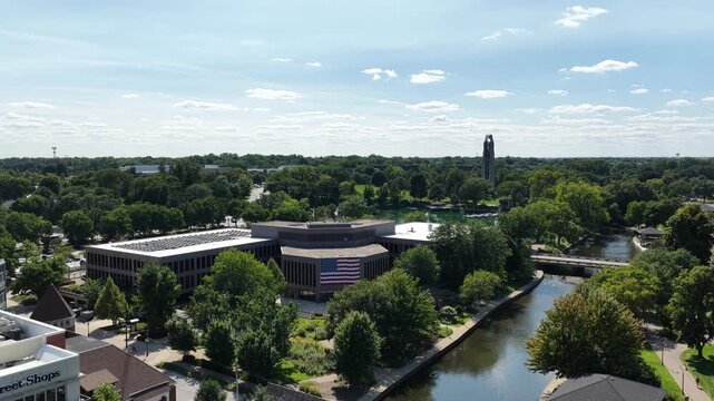  Aerial View of Naperville Riverwalk and Carillon Tower on a Sunny Day&rdquo;