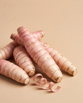 rrowroot Tubers with Starch Powder, Raw Garut Root Vegetable on Beige Studio Background