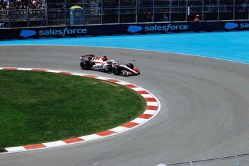 Fototapeta premium May 24, 2026, Montreal, Canada, Esteban Ocon races a Haas F1 car at Circuit Gilles-Villeneuve. g.