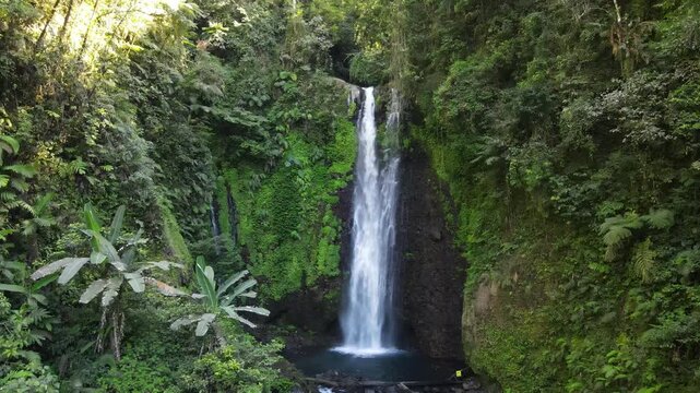 Aerial Scenery of Cidadap Waterfall Hidden in a Tropical Forest with Pristine Waters and Various Wild Trees During Morning in Indonesia.