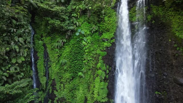 Aerial Scenery of Cidadap Waterfall Hidden in a Tropical Forest with Pristine Waters and Various Wild Trees During Morning in Indonesia.
