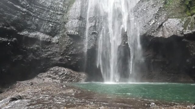 Footage of beautiful view of Madakaripura waterfalls the tallest waterfalls in Java island and second tallest waterfalls in Indonesia.
