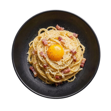 Gourmet spaghetti carbonara pasta topped with fresh raw egg yolk