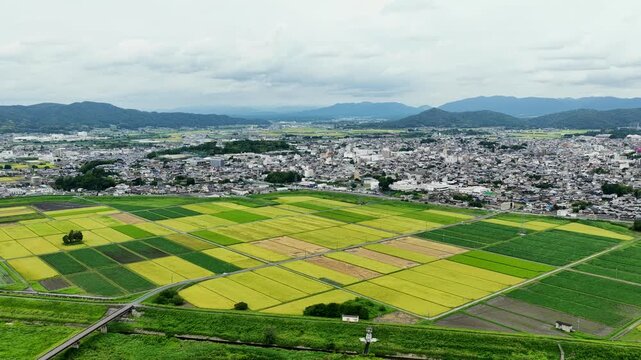 Aerial drone footage over rural and urban mixed landscape in Iga, Mie, Japan
