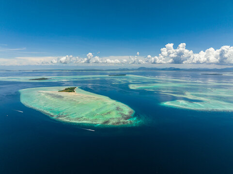 Tropical islands and coral reef in tropic. Tun Sakaran Marine Park. Borneo, Sabah, Malaysia.