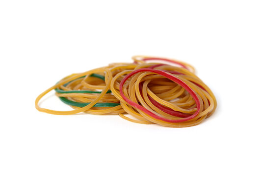 A pile of elastic rubber bands, isolated on a white background.
