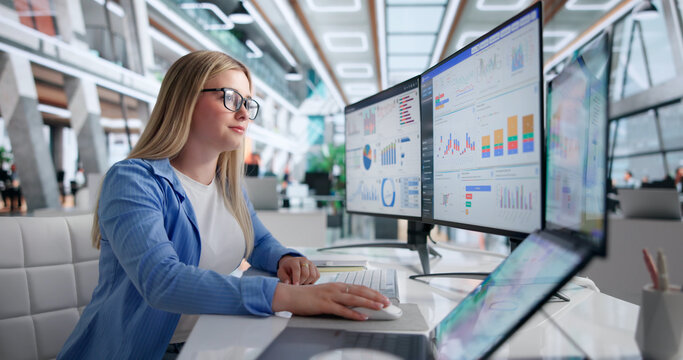 Young Woman Focused On Analyzing Financial Data