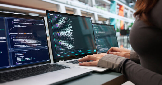 Young Woman Writes Code