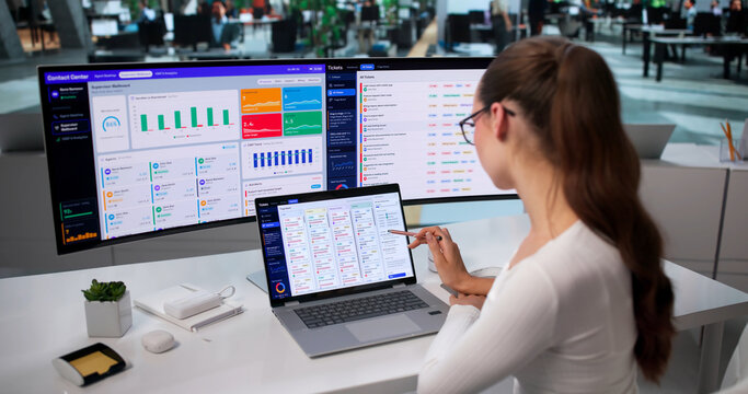 Woman Using Laptop To Track