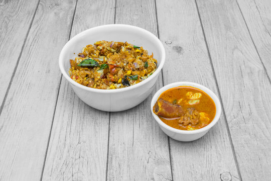 South Indian egg kothu parotta served with curry