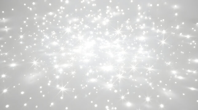 White light sparkles and glowing star flares on a soft abstract background