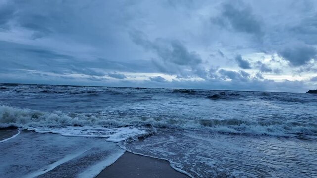 Tropical beach and ocean coastline on Koh Chang under an overcast sky in Thailand