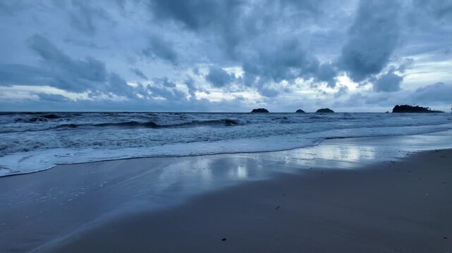 Tropical beach and ocean coastline on Koh Chang under an overcast sky in Thailand