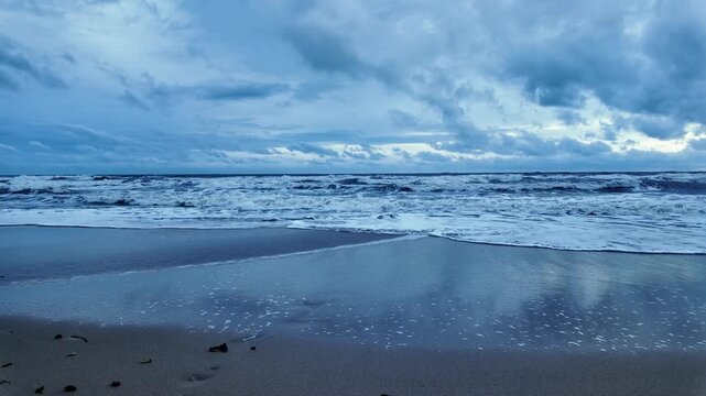 Tropical beach and ocean coastline on Koh Chang under an overcast sky in Thailand